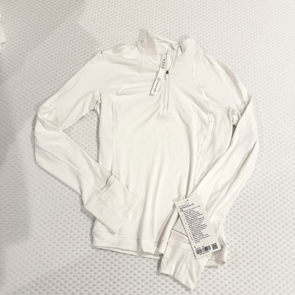 lululemon “It’s Rulu Run 1/2 Zip” in white. size 6 NWT!